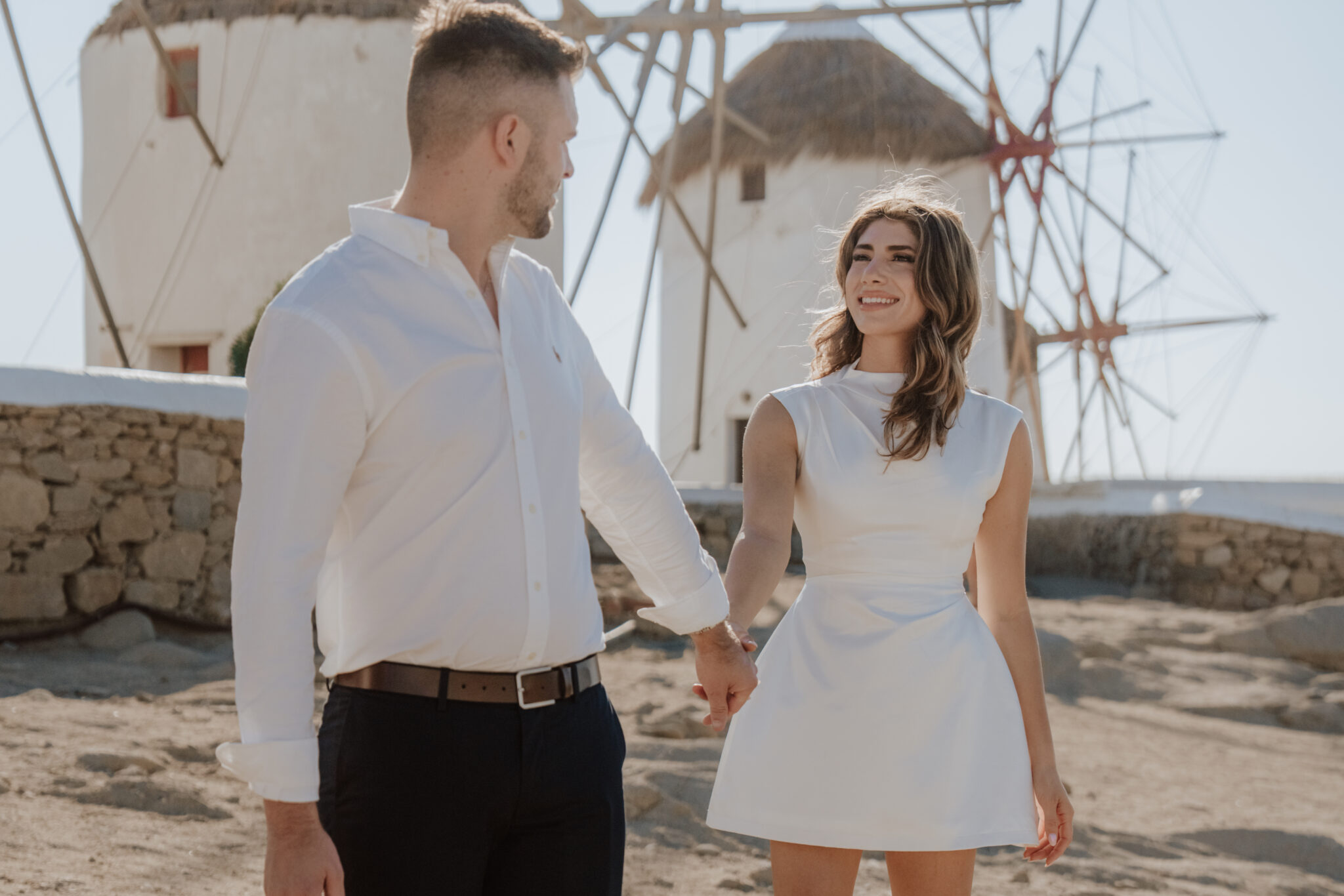 Bride looking out over the Aegean Sea – natural light destination wedding photography in Greece