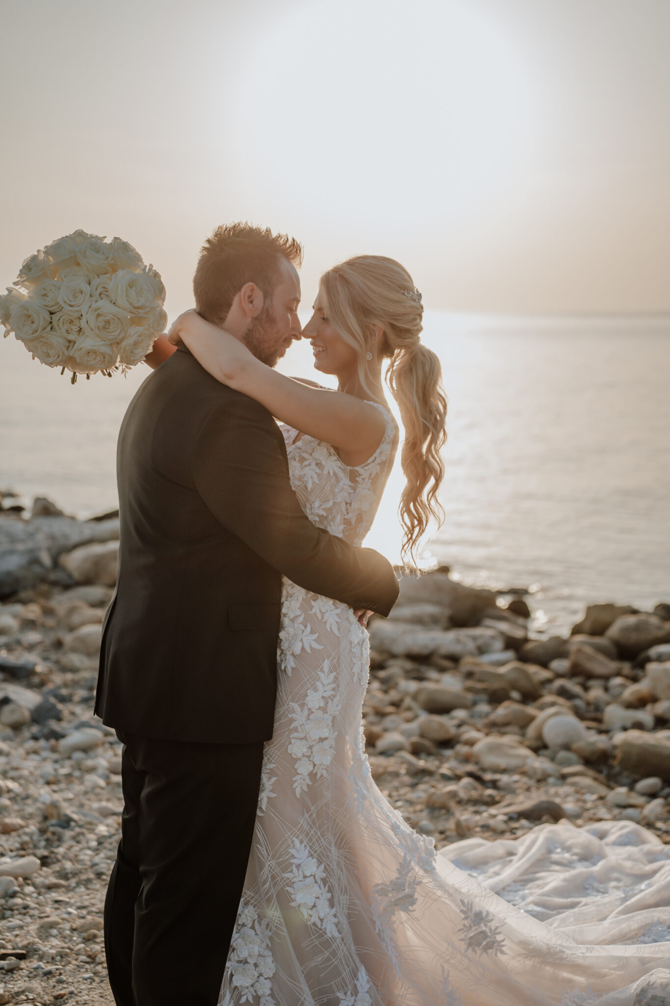 Sunset kiss in Mykonos captured by destination wedding photographer in Greece